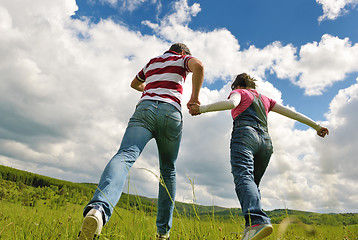 Image showing Portrait of romantic young couple smiling together outdoor