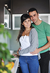 Image showing young couple have fun in modern kitchen