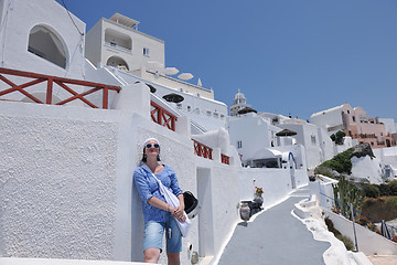 Image showing Greek woman on the streets of Oia, Santorini, Greece