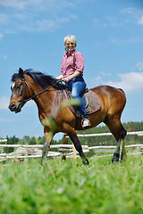 Image showing happy woman  on  horse