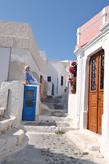 Image showing Greek woman on the streets of Oia, Santorini, Greece