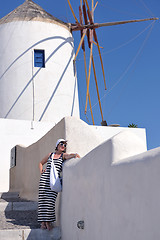 Image showing Greek woman on the streets of Oia, Santorini, Greece