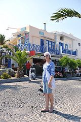 Image showing Greek woman on the streets of Oia, Santorini, Greece