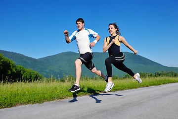 Image showing Young couple jogging