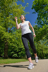 Image showing Young beautiful  woman jogging at morning in park