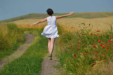 Image showing young woman in wheat field at summer