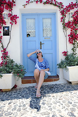 Image showing Greek woman on the streets of Oia, Santorini, Greece