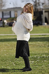 Image showing happy young pregnant woman outdoor