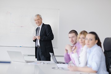 Image showing Senior business man giving a presentation