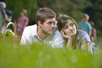 Image showing happy young couple having a picnic outdoor