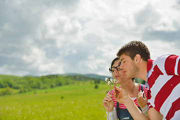 Image showing Portrait of romantic young couple smiling together outdoor