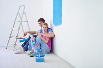 Image showing happy young cople relaxing after painting in new home