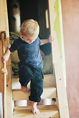 Image showing beautiful young child making first steps