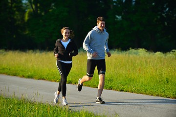 Image showing Young couple jogging