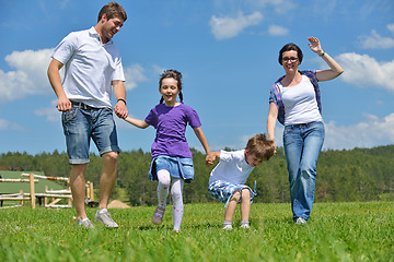 Image showing happy young family have fun outdoors