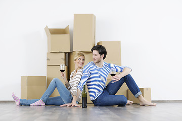 Image showing Young couple moving in new home