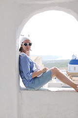 Image showing Greek woman on the streets of Oia, Santorini, Greece