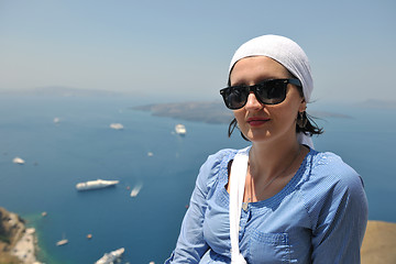 Image showing Greek woman on the streets of Oia, Santorini, Greece