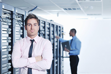 Image showing it enineers in network server room