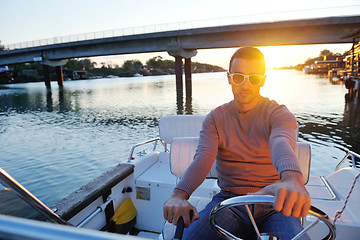 Image showing portrait of happy young man on boat