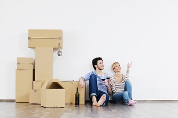 Image showing Young couple moving in new house