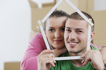 Image showing Young couple moving in new house