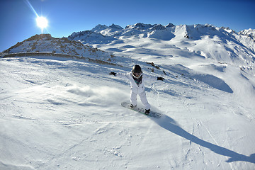 Image showing skiing on fresh snow at winter season at beautiful sunny day