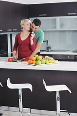 Image showing young couple have fun in modern kitchen