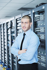 Image showing young it engeneer in datacenter server room