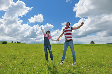 Image showing Portrait of romantic young couple smiling together outdoor