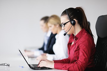 Image showing business woman group with headphones