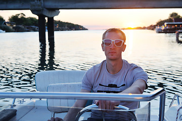 Image showing portrait of happy young man on boat