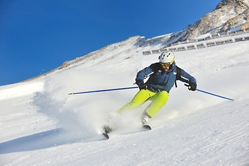 Image showing skiing on fresh snow at winter season at beautiful sunny day