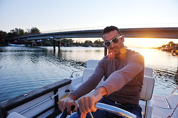 Image showing portrait of happy young man on boat