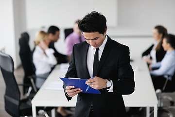 Image showing young business man at meeting