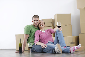 Image showing Young couple moving in new home