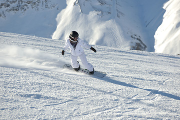 Image showing skiing on fresh snow at winter season at beautiful sunny day