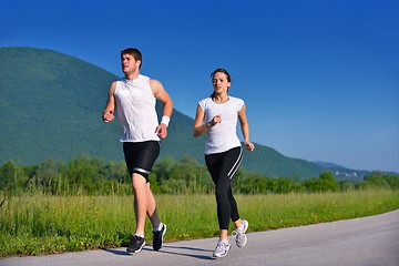 Image showing Young couple jogging