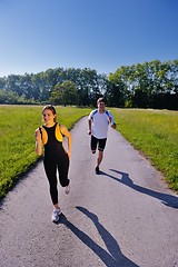 Image showing Young couple jogging