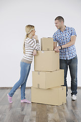 Image showing Young couple moving in new home