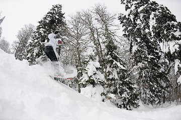 Image showing snowboarder on fresh deep snow