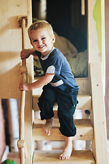 Image showing beautiful young child making first steps