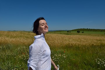 Image showing young woman in wheat field at summer