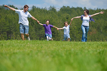 Image showing happy young family have fun outdoors