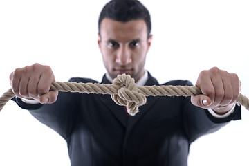 Image showing business man with rope isolated on white background