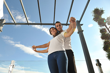 Image showing couple relaxing on balcony