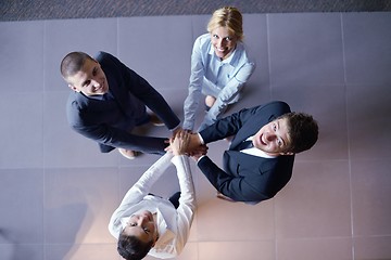 Image showing business people group joining hands