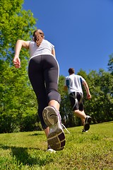 Image showing Young couple jogging at morning