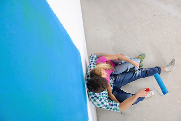 Image showing happy young cople relaxing after painting in new home