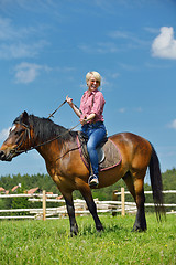 Image showing happy woman  on  horse